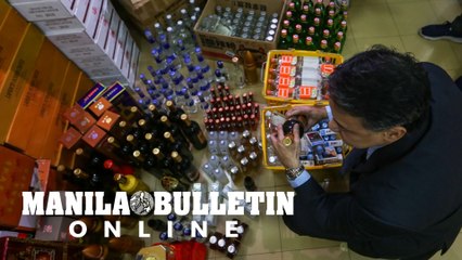 BIR confiscates Chinese liquor and cigarettes at a convenience store