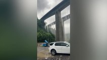 Rushing water overflows from bridge after heavy rain in China