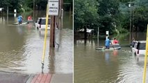 Residents kayak through flooded town as Vermont hit by severe flooding