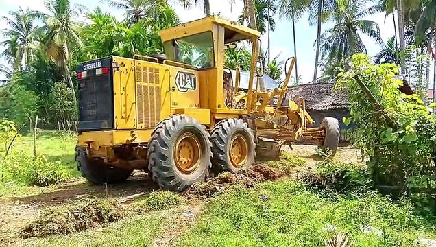 Caterpillar 120K VHP 145 Grader Cleaning Village Road