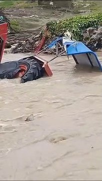 Video... Farms became ponds, houses became islands, tractor swept away