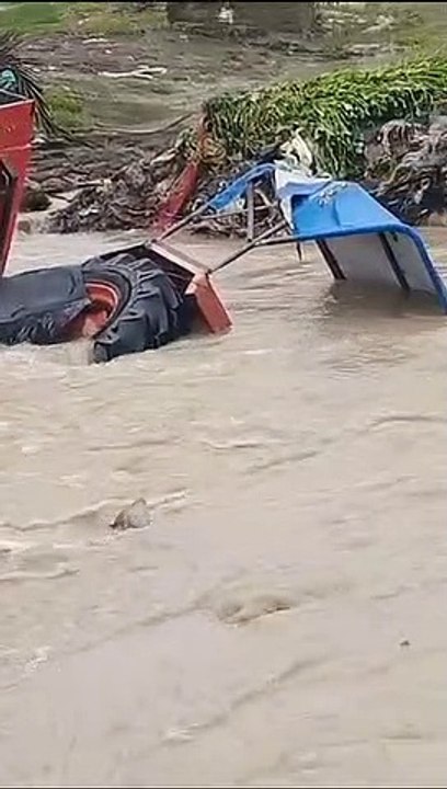 Video... Farms became ponds, houses became islands, tractor swept away