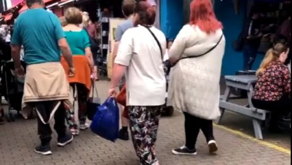 Full-of-life man on a mobility scooter sparks joy in busy market