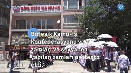 Kamu çalışanları zamları şemsiye açarak protesto etti