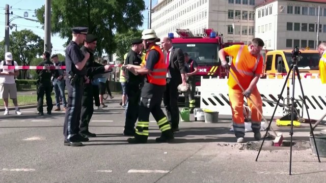 German climate protester glues hand to street