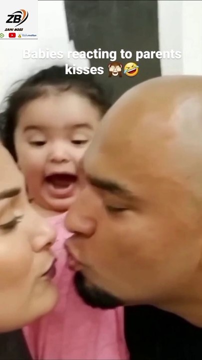 Babies reaction to parents kisses
