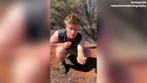 Robert Irwin, 19, sends fans into a frenzy as he flaunts his biceps in a sleeveless shirt in the outback: 'Oh he's cute'