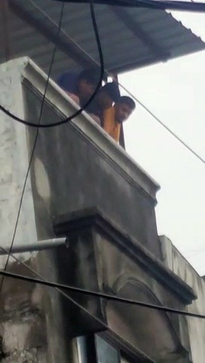 Video Viral: Youth standing on terrace spit on devotees participating