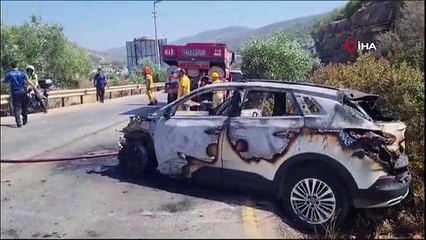 Otomobildeki yangın otluk alana sıçradı