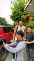 Fans take turns posing with Bai June Mar Fajardo outside the Gilas practice venue 