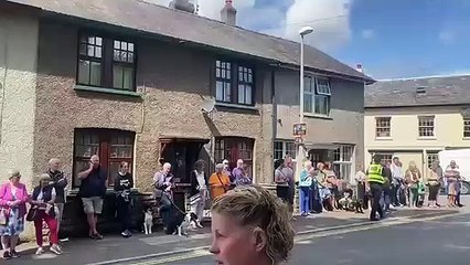 Crowds line the road to Brecon Cathedral