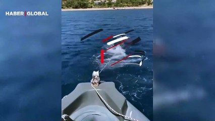 İş insanı Sadettin Saran, denizde arızalanan botunu yüzerek karaya böyle çekti