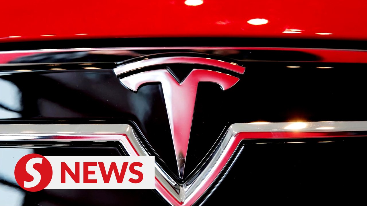 Tesla, Netflix pull Nasdaq and S&P lower, Dow e...