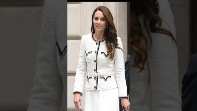Kate Middleton looked gorgeous in this black & white tweed peplum jacket with a white pleated midi