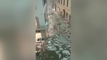 Ice and water flows through streets of Italian town after freak hail storm