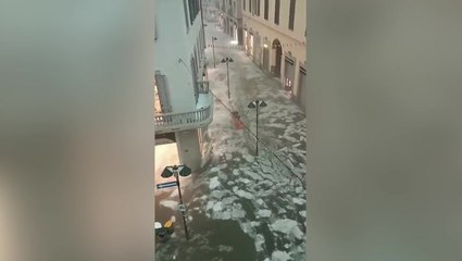 Ice and water flows through streets of Italian town after freak hail storm