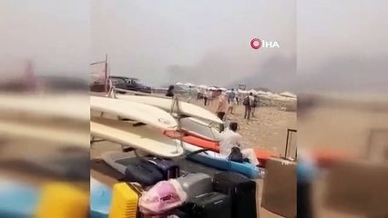 Rodos'taki yangından kaçan turistler sahillerde yardım bekliyor