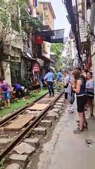 Couple Visit Hanoi's Famous Train Street