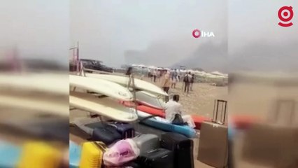 Rodos’taki yangından kaçan turistler sahillerde yardım bekliyor