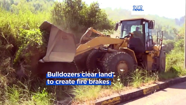 Firefighters contain wildfires on Greek islands but risk remains