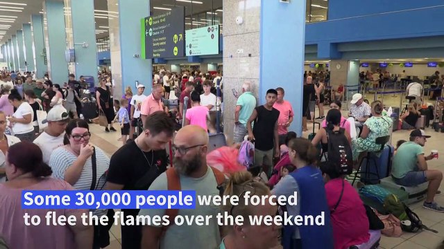 Tens of thousands flee as fires ravage Greek island of Rhodes