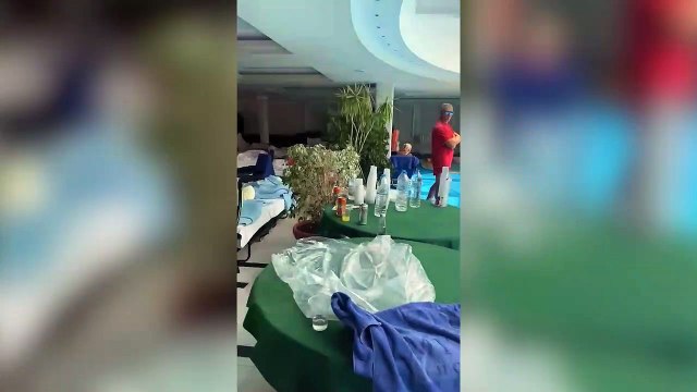 Tourists sleep near hotel pool after being evacuated from Rhodes wildfires