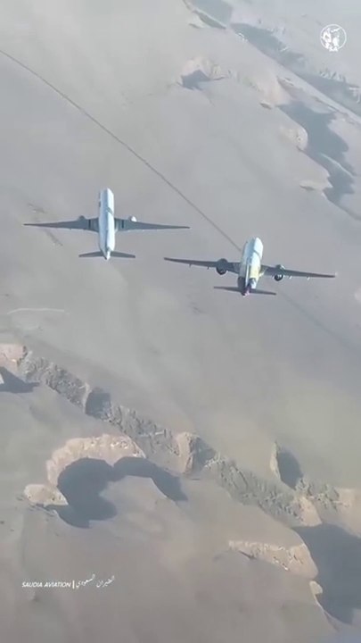 Beautiful View To Planes Saudi Arabia Airline And Serene Airline  Crossing Each Other