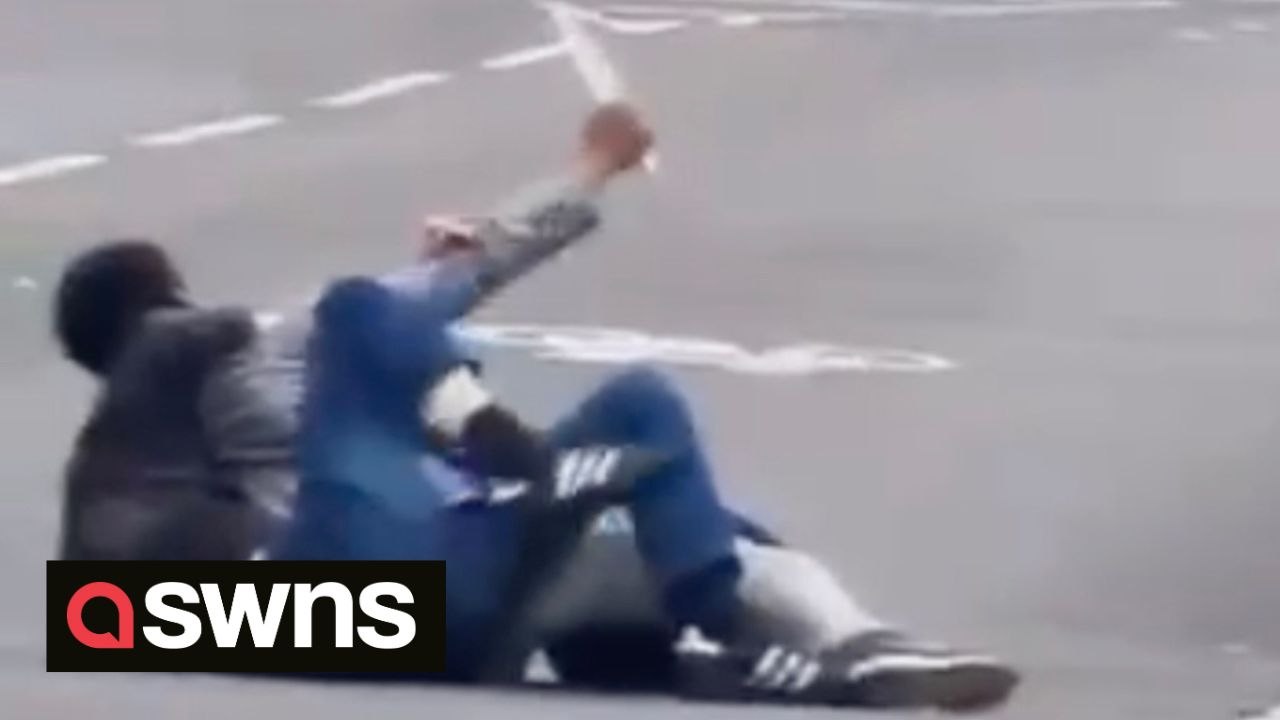 Man disarms knife-wielding thug as they wrestle in the middle of 'Britain's roughest street'