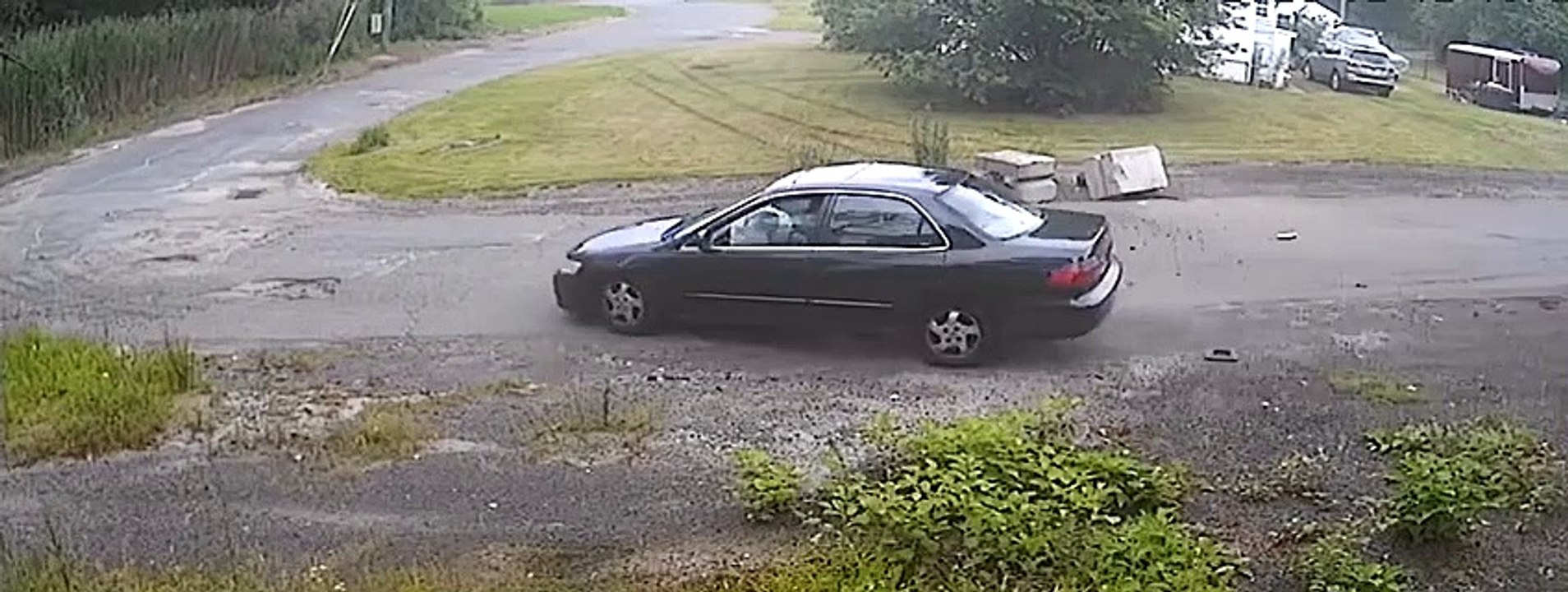 Car Drives Over Lawn To Hit Cement Mailbox