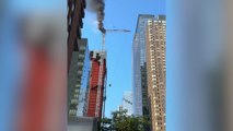 Crane catches fire in Manhattan, partially collapses