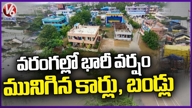 Cars and Bikes Submerged In Flood Water | Warangal | V6 News