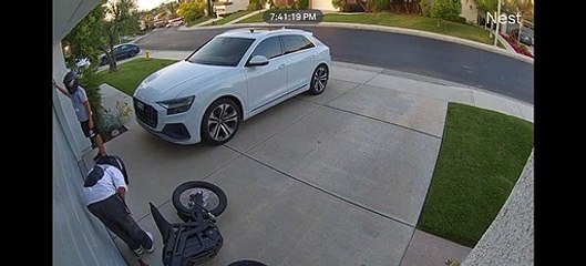 Kid Drives  Dirt Bike Into Garage Door