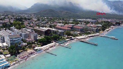 Kemer'deki Orman Yangınından Haberdar Olan Tatilcilerin Yakınlarına Dron ve Kamera Görüntüleri İle Güven Veriliyor