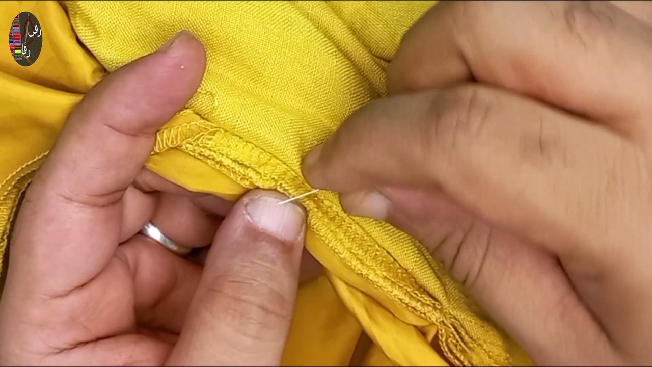 Re-weaving pieces into women's trousers and mending them again.