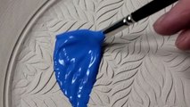 Ceramist exceptionally transforms a ceramic plate by coating it with glaze