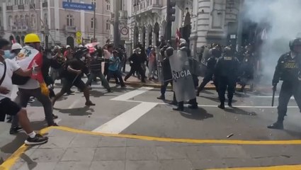 Police use tear gas and clash with anti-government protesters in Peru