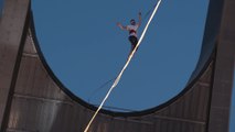 Slackline world champion sets new record in Qatar, crossing thin rope across Doha skyline