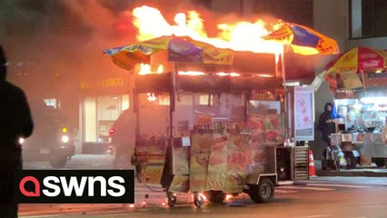 New Yorkers ignore hotdog stand as it becomes engulfed in flames