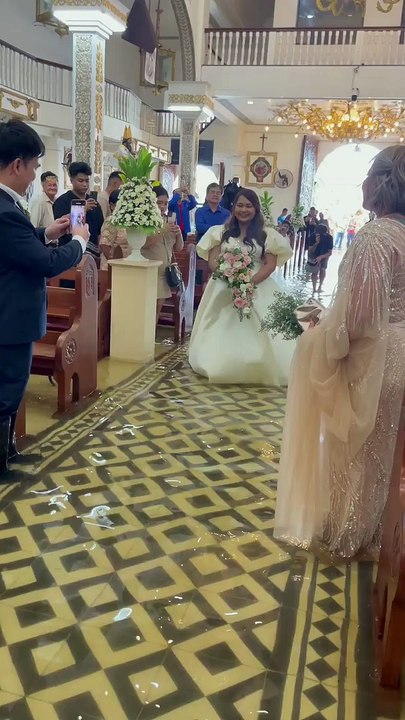 Watch: Bride walks down flooded aisle