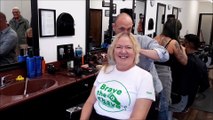 Marianne Wright with barber Peter Jones doing Brave the Shave for Macmillan Cancer Support