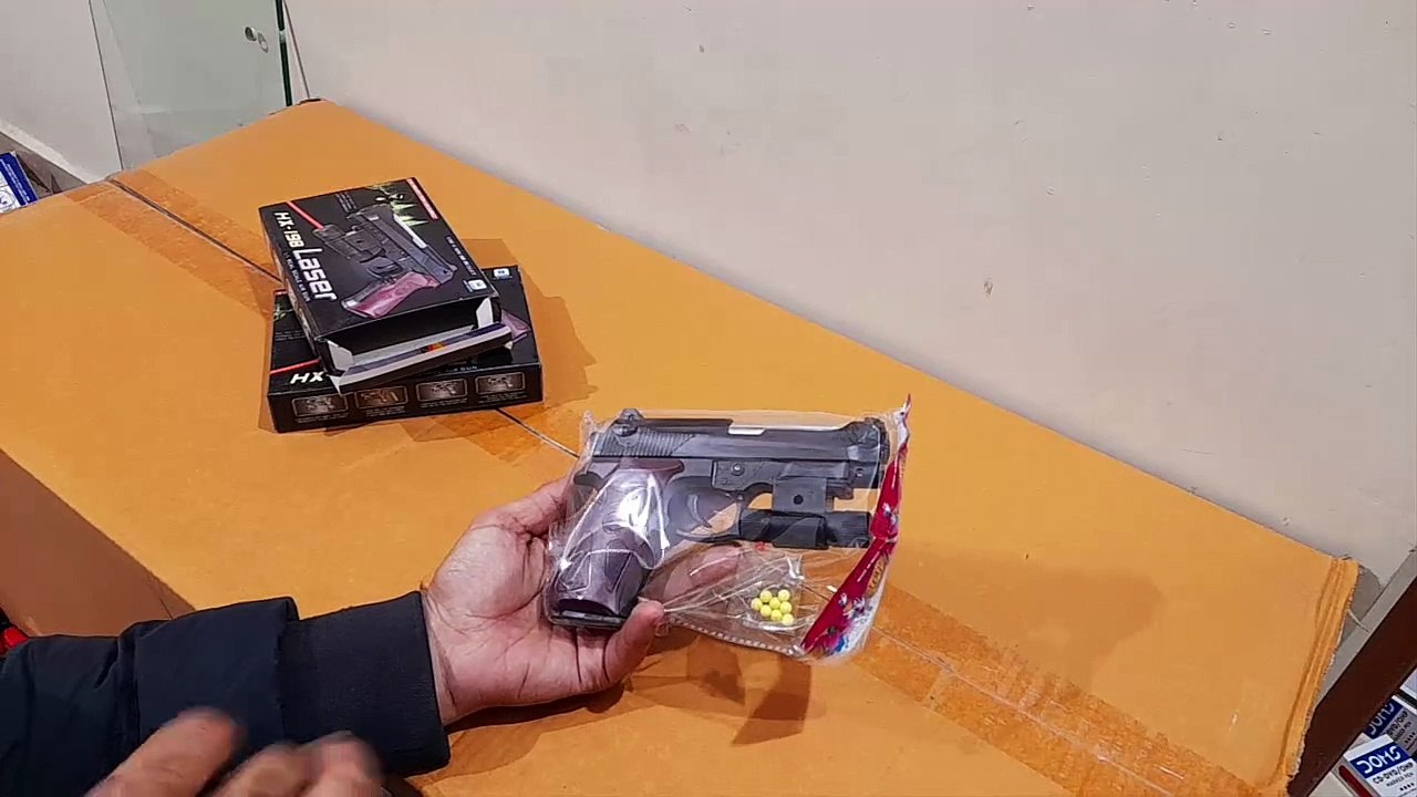 Unboxing and Review of Beginner Laser Light Gun Toy with plastic Bullets for gift