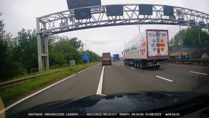 Dramatic moment cow falls from lorry in to live traffic on M6