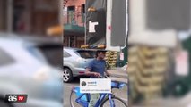A man in New York goes viral after carrying a couch with his head while he rides a bike