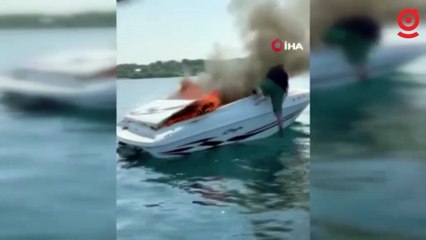 Yanan tekneden denize atlayarak kurtuldular