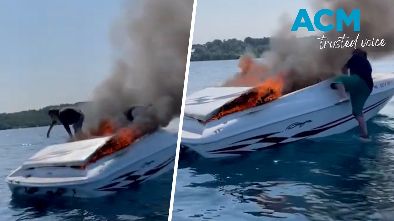 Two people rescued after jumping from burning boat