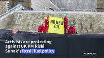 Environmental activists cover UK PM Sunak's home in black fabric