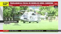 Momento exacto del traslado del fiscal de Morelos, Uriel Carmona, hacia la Ciudad de México