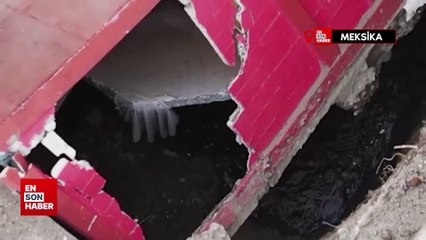Meksika’da bir bina yolda oluşan dev çukurun içine devrildi