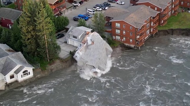 Alaska house crashes into river as glacier flooding batters riverbank