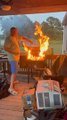Guy Puts Out Barbecue's Fire After He Forgets to Clean Pellet Grill Before Cooking on it
